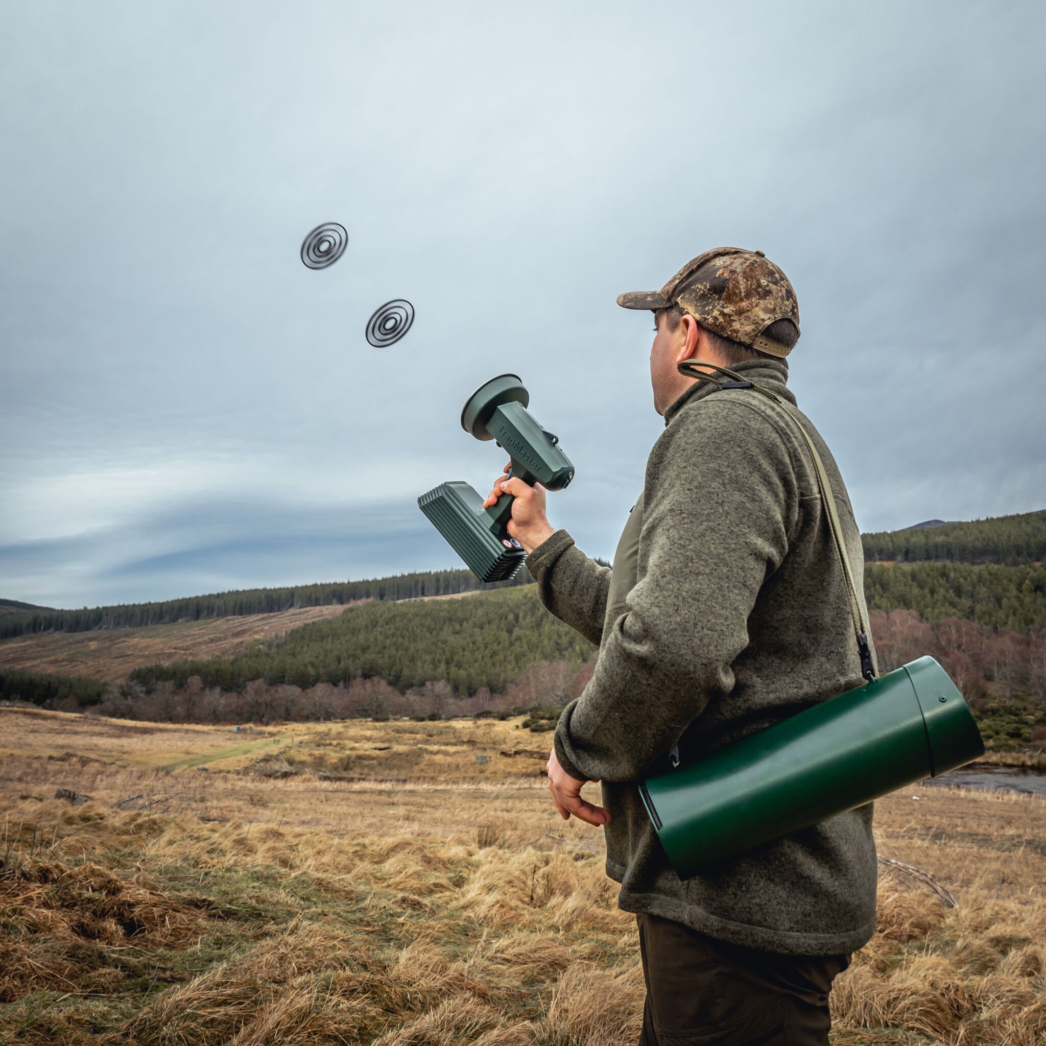 Man throwing clay pigeons